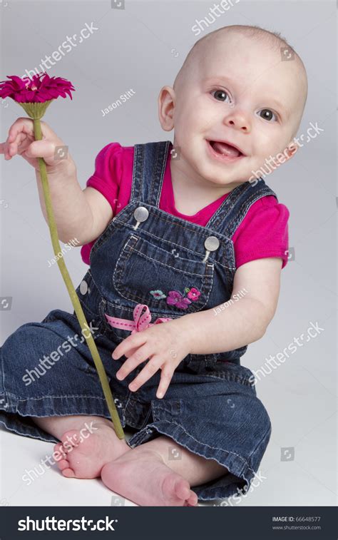 Beautiful Baby Girl Holding Flower Stock Photo 66648577 Shutterstock