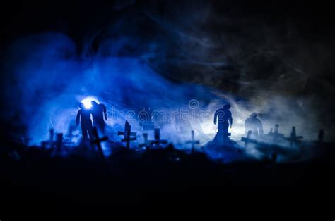 Silhouette Of Zombies Walking Over Cemetery In Night Horror Halloween