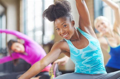 Her Happy Pose An Attractive Woman Stretching In Yoga Class Stock