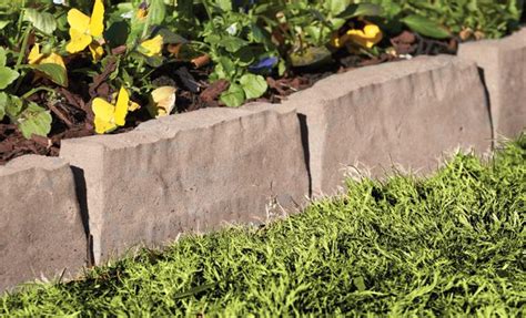 Landscape timbers, long pieces of square or rounded lumber, work well as a border for straight driveways. edging - tuscan | Flower bed edging, Landscaping with ...