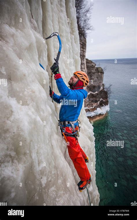 An Ice Climber In Northern Michigan Climbing At Pictured Rocks
