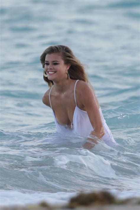 Nina Agdal Has A Couple Wardrobe Malfunctions While Navigating The Surf For A Photoshoot