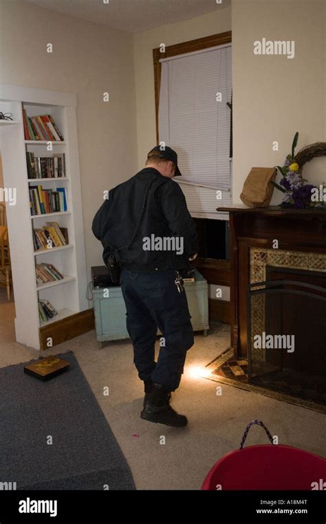 Crime Scene Technician Photographs Bedroom After A Burglary Kansas City Mo Pd Crime Lab Stock