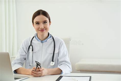 Portrait Of Young Female Doctor In White Coat Stock Image Image Of