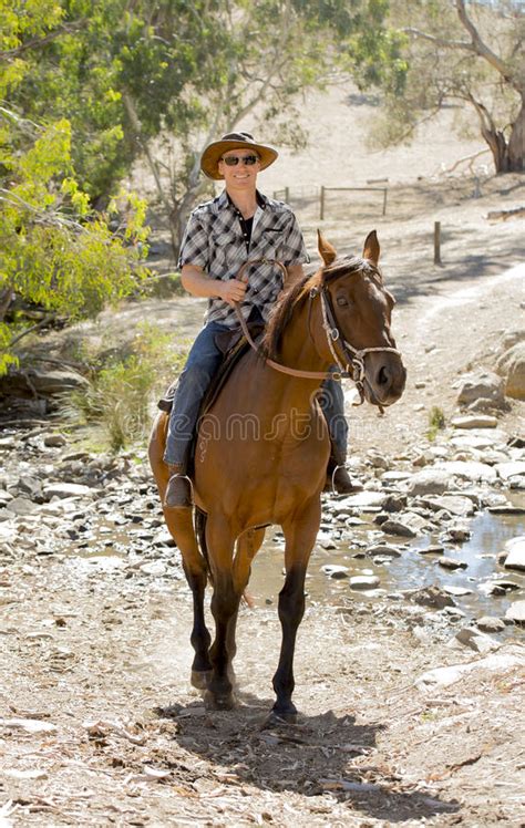 Instructor Or Cattleman Riding Horse In Sunglasses Cowboy