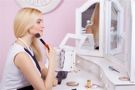 Beautiful Woman Is Doing Makeup In Front Of Mirror Stock Image Image Of Feminine Applying