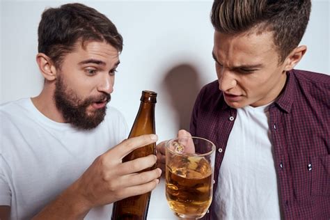 Premium Photo Two Men Have Fun Drink Beer And Eat Fast Food