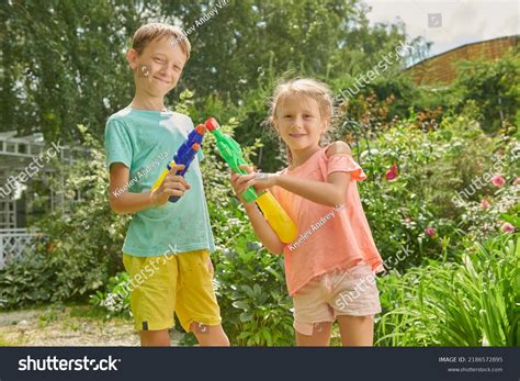 Two Joyful Kids Playing Water Guns Stock Photo 2186572895 Shutterstock
