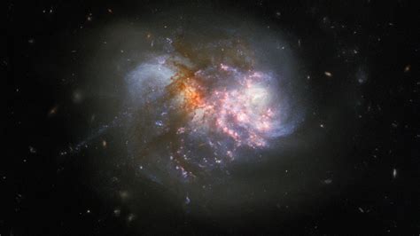 Two Galaxies Collide In Chaotic Hubble Image Mashable