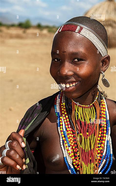 Laughing Young Woman With Necklace From The Tribe Of Erbore Turmi
