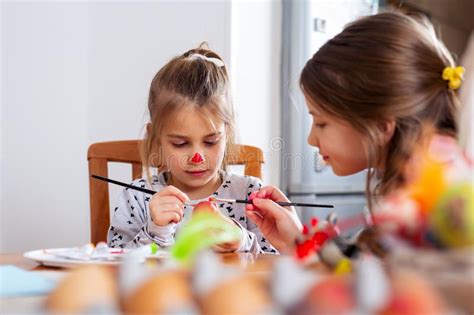 Happy Easter A Beautiful Child Girl Painting Easter Eggs Stock Photo
