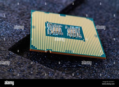 Pc Micro Cpu With Gold Plated Contacts On A Textured Dark Background Modern Central Processing