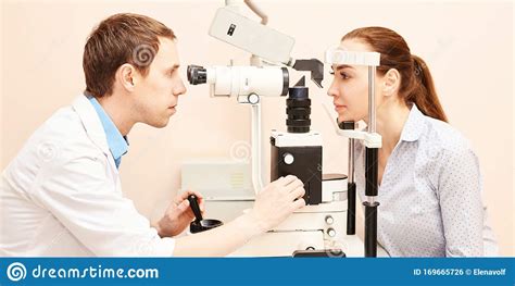 Ophthalmologist Doctor in Exam Optician Laboratory with Male Patient. Men Eye Care Medical ...