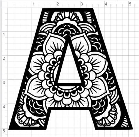 The Letter Is Made Up Of Black And White Floral Designs On A Sheet Of Paper
