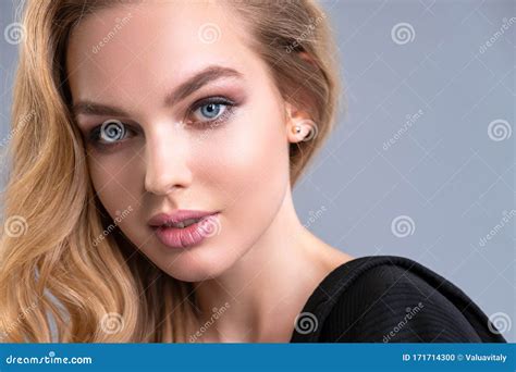 Beautiful Face Of An Attractive Model With Blue Eyes Woman With Beauty Long Brown Hair And
