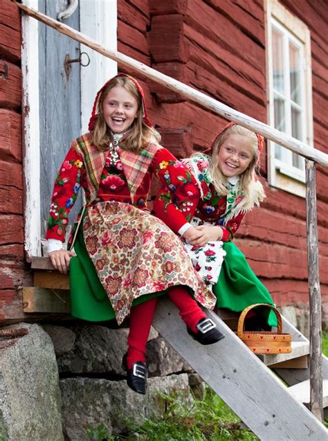 Two Girls In Brightly Colored Folk Costumes From Dala Floda Sweden