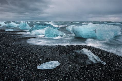 Oc Icebergs Washing Up On A Black Volcanic Sand Beach Across The Ring
