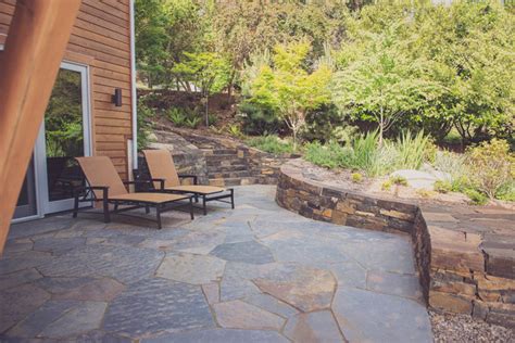 Ledgestone Staircase With Stacked Basalt Retaining Walls And Flagstone