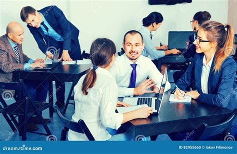 Coworkers Working Effectively On Business Project Together Stock Photo