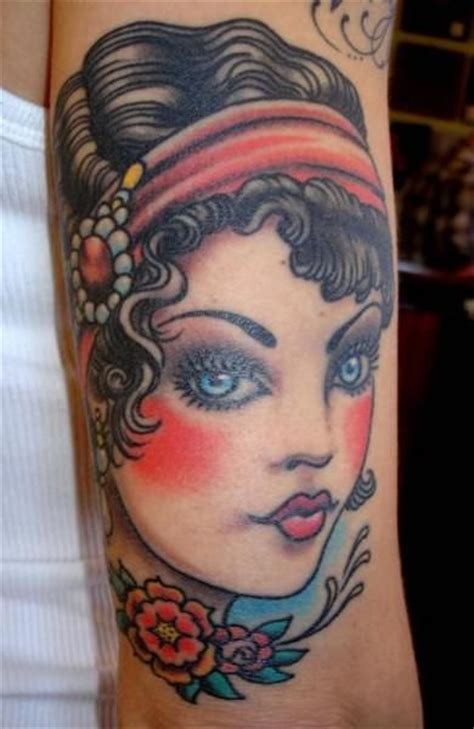 Tattoo on calf men in the style of biomechanics. Cute woman vintage style tattoos