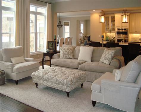 neutral living room  overstuffed beige sofa beige