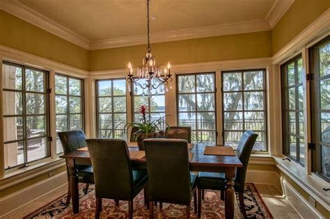 The Windows Surrounding This Dining Room Table Offer Breathtaking Views
