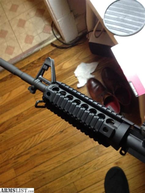 Armslist For Sale Bushmaster Ar 15 With A Midwest Industries Quad