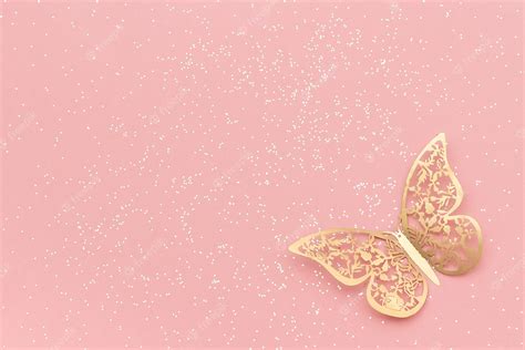 Premium Photo Sparkles Glitter And Gold Tracery Butterfly On Pink