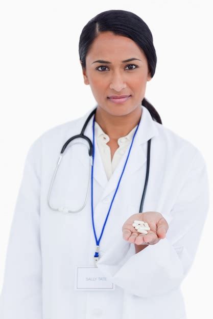 Premium Photo Female Physician Holding Pills In Her Hand