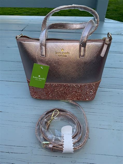 pink kate spade purse with glitter on bottom