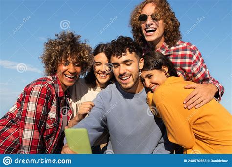 Group Of Happy Young Multiracial Friends Having Fun Take Selfie Together Using Cellphone