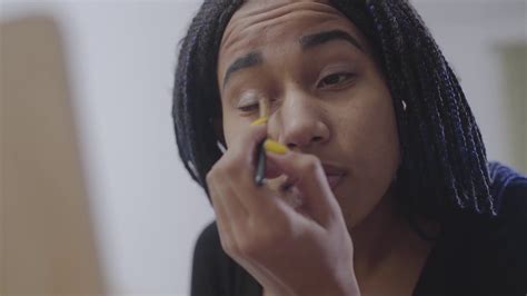 Close Up Face Of African American Teenage Girl Applying Eyeshadows