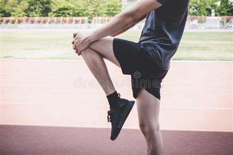 Young Fitness Athlete Man Running On Road Track Exercise Workout
