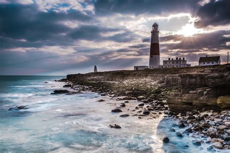 Dramatic Sunset With Iconic Lighthouse On Coast Codfathers
