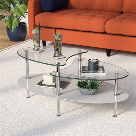 This glass coffee table is made of metal and tempered glass. Home Loft Concept Glass Oval Coffee Table & Reviews ...