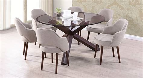Buy six seater dining table set online from amazing 6 pc dining set collection. Matheson - Nubica 6 Seater Round Glass Top Dining Table Set - Urban Ladder