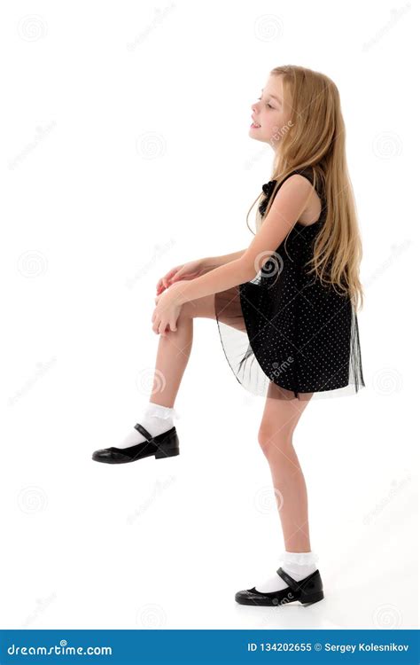 The Little Girl Is Standing On One Leg Stock Image Image Of