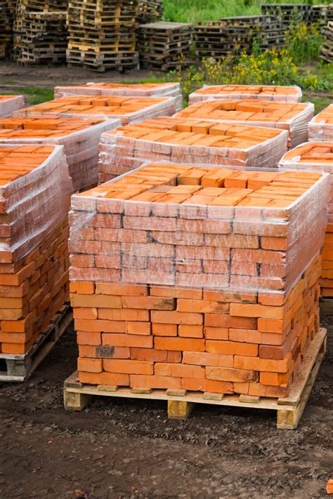 Red Clay Bricks Are Stacked On Wooden Pallets Production Of Bricks From Clay Stock Image