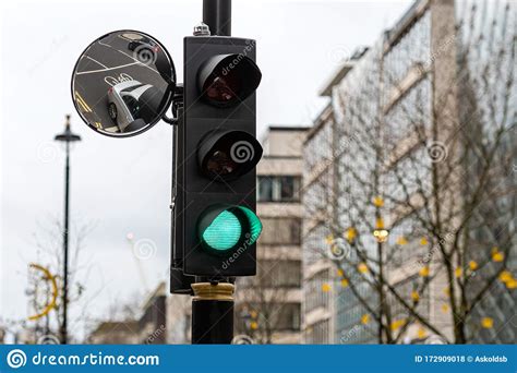 Green Traffic Light Signal And Traffic Convex Mirror With The