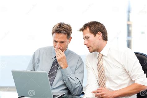 Two Concentrated Businessmen Working Together Stock Photo Image Of