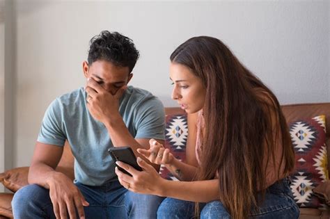 Premium Photo Infidelity Jealous Girlfriend Showing His Cheating Babefriend His Phone
