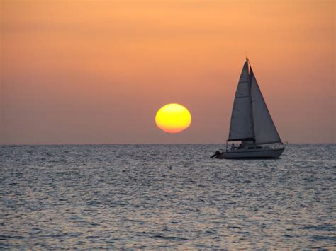 Free Images Sea Water Ocean Horizon Sky Sun Sunrise Sunset Boat Wave Vacation
