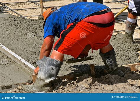 Concrete Worker Screeding And Leveling The Wet Mud Stock Image Image