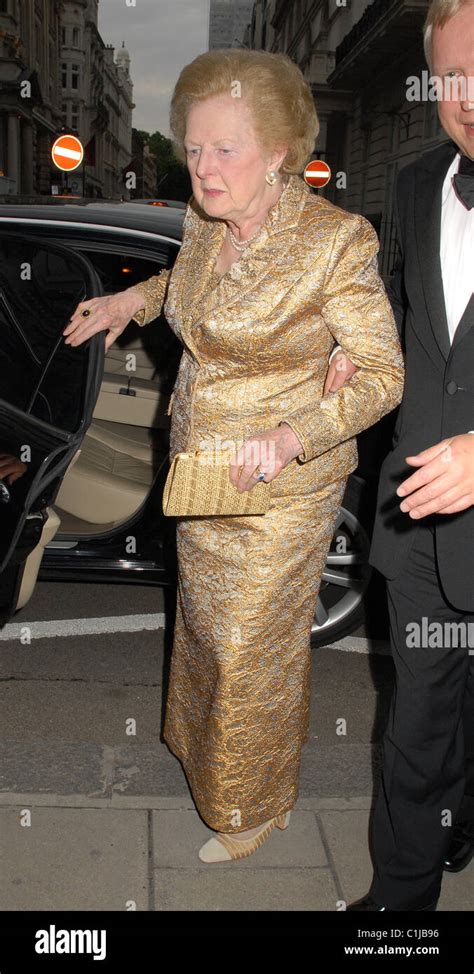 Former British Prime Minister Margaret Thatcher In A Gold Evening Dress