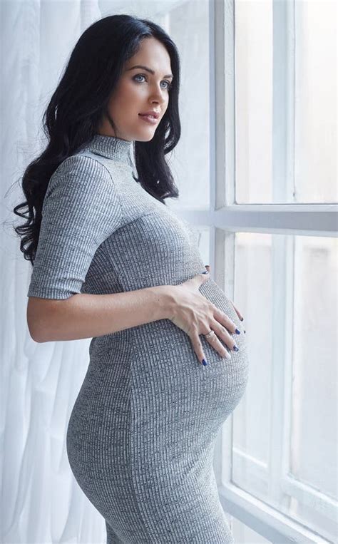 Pregnant Brunette Woman In A Grey Dress Stock Photo Image Of Bright