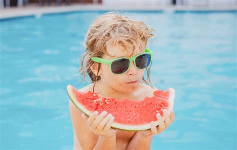 Child Eating Watermelon Near Swimming Pool During Summer Holidays Kids