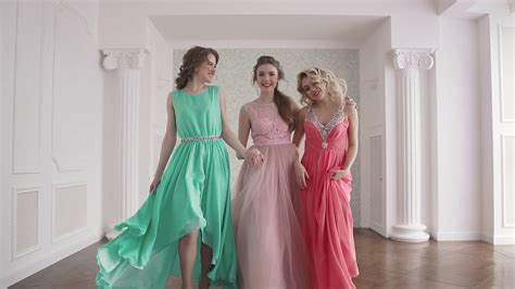 Portrait Of Three Girlfriends In Elegant Dresses Girls Laugh And Fool