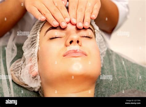 Head Massage Beautiful Caucasian Young White Woman Receiving A Head And Forehead Massage With