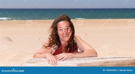 Woman In Summer Beautiful With Healthy Sun Tan Skin Tanning On Beach Sand Happy Female Model