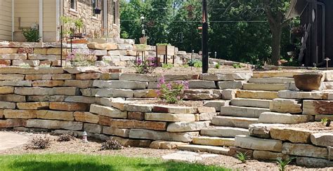 If you aren't certain how to move a boulder safely, ask a professional landscaper or the landscape supply yard where you buy from. Chilton Stone Outcroppings Retaining Wall Stone Steps Landscape Design Buechel Stone